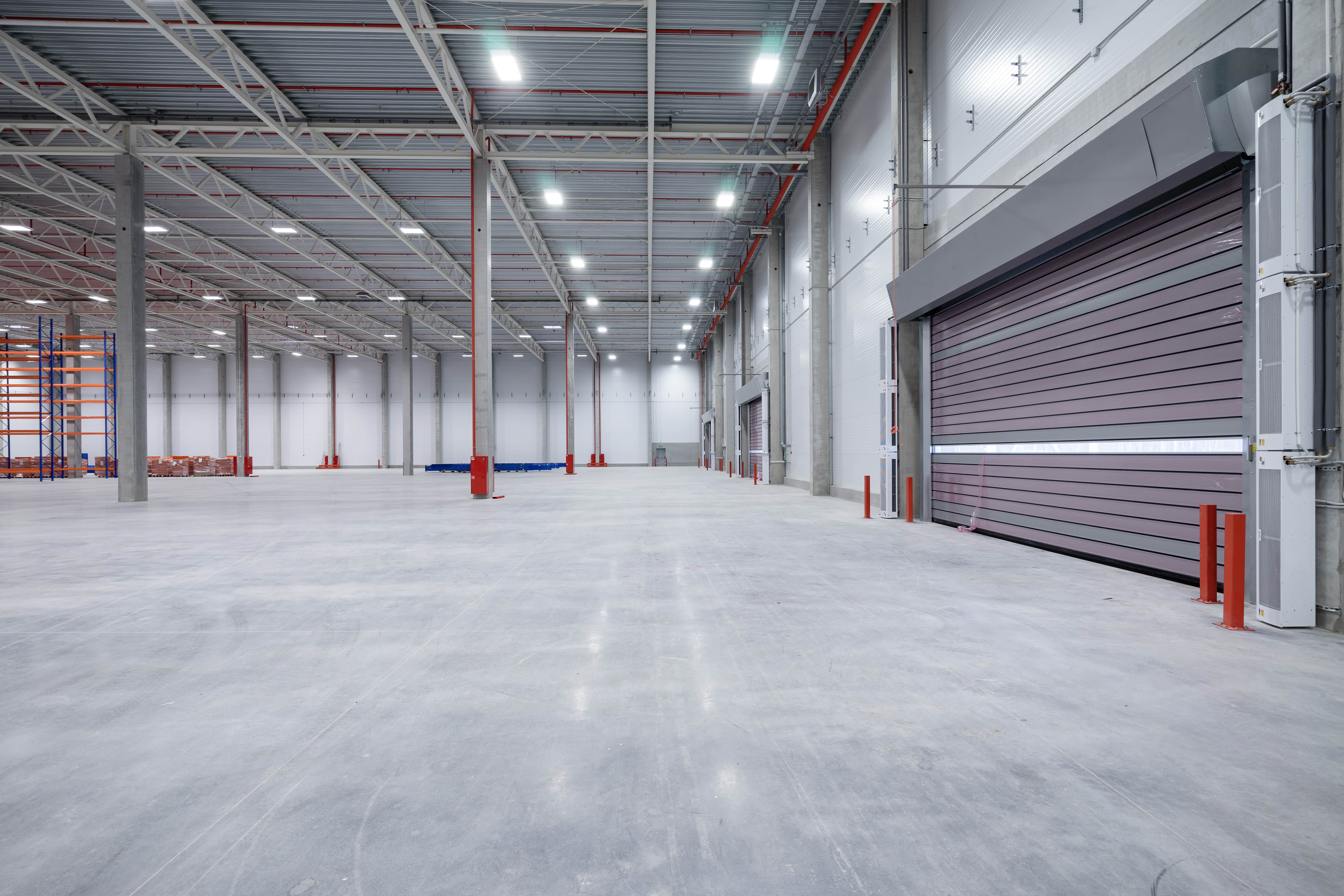 Polished concrete warehouse floor with clinical finish